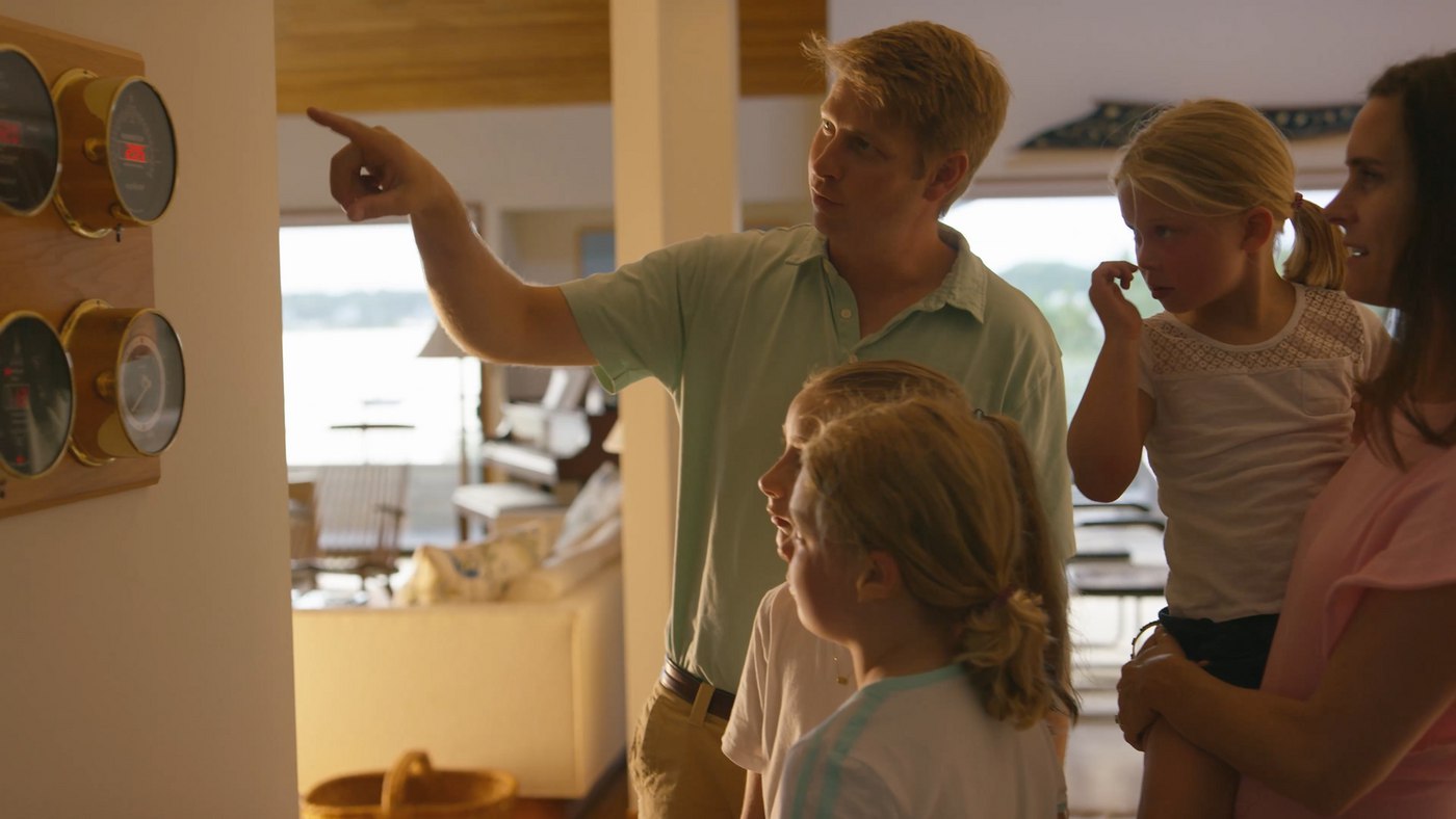Larsen family with instruments The Larsen Family using a Maximum preconfigured weather station in their home